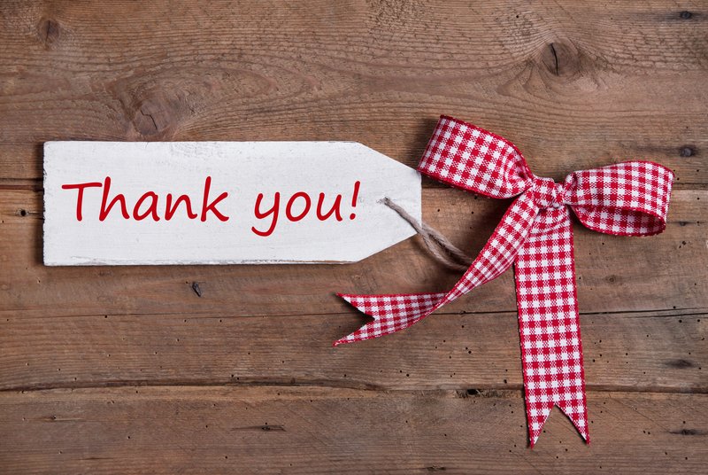 red and white ribbon and thank you tag